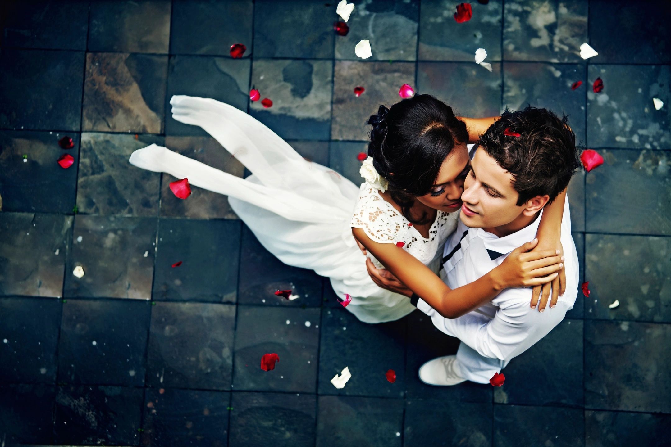 bride and groom dancing in the street