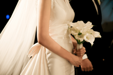a bride with a beautiful bouquet of calla lillies